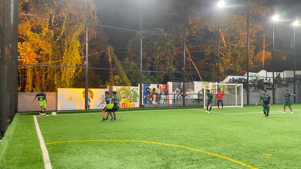 Floodlit evening football match at Joyous Sports Arena, Chingavanam